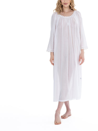 White Full Length (126cm) long sleeve nightgown. Lace details on gently rounded neckline and sleeve cuff. Flared skirt for ease of movement when sleeping. Made in Germany from the finest pure Swiss cotton, Celestine nightdresses are diaphanous, offering perfect sleep without heaviness. Celestine nightwear, dressing gowns and short robes drop from the shoulder, therefore one size fits all.  Fabric composition:  100% Pure Swiss Cotton. 100% Guipure Cotton Lace. Machine Washable.