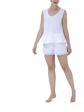 Load image into Gallery viewer, 100% Pre-washed Linen Shorty Pyjama set. The top has wide straps in a singlet style.  The gently rounded neckline is trimmed with cotton lace. The shorts are loose fitting and have an elasticated waist and have a wide lace trim on the hem. Made in Germany from the finest pure linen. Perfect for sleep without heaviness.  Celestine garments are also addictive, so watch out. Once tried, there is no turning back!   Composition: 100% Linen 100% Guipure Lace Machine Washable
