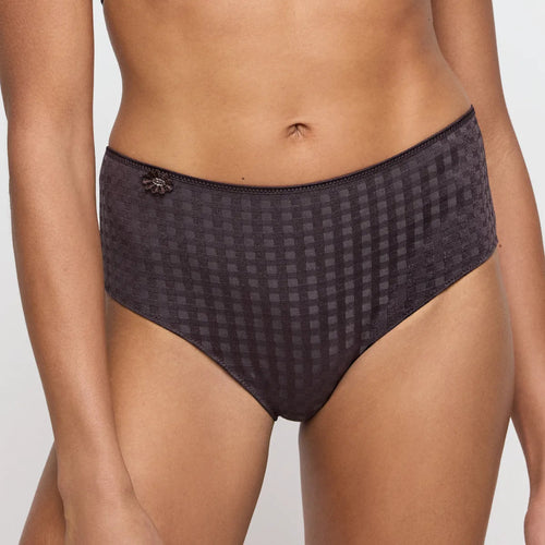 Patterned underwear worn by a person on a plain background