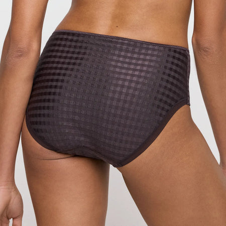 Black checkered underwear worn by a person on a light gray background