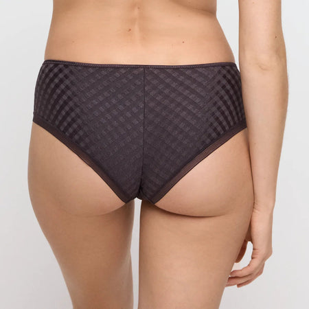 Patterned underwear worn by a person on a plain background