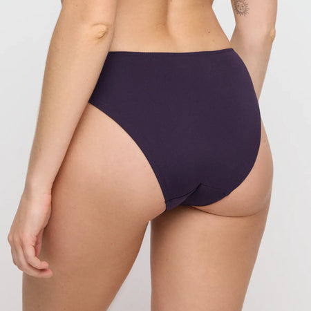 Navy blue high-waisted bikini bottom on a neutral background
