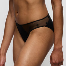 Load image into Gallery viewer, Black sheer bikini bottom worn by a person on a plain background
