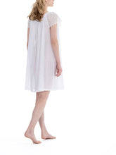 Load image into Gallery viewer, White Short (96cm) short sleeve nightgown. Lace detail on the gently rounded neckline with beautiful all lace short sleeve. Flared skirt for ease of movement when sleeping. Made in Germany from the finest pure Swiss cotton, Celestine nightdresses are diaphanous, offering perfect sleep without heaviness. Celestine nightwear, dressing gowns and short robes drop from the shoulder, therefore one size fits all.  Fabric composition:  100% Pure Swiss Cotton. 100% Guipure Cotton Lace. Machine Washable.
