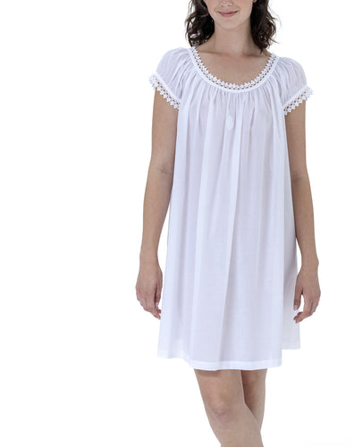 Very beautiful short (92cm) short sleeve nightgown. Lace detail on the gently rounded neckline and sleeve hem. Flared skirt for ease of movement when sleeping. Made in Germany from the finest pure Swiss cotton, Celestine nightdresses are diaphanous, offering perfect sleep without heaviness. Celestine nightwear, dressing gowns and short robes drop from the shoulder, therefore one size fits all. Fabric composition: 100% Pure Swiss Cotton. 100% Guipure Cotton Lace. Machine Washable.