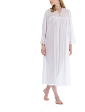 Load image into Gallery viewer, White Full Length (123cm) long sleeve nightgown. Heavy lace throughout the bodice. on the V neckline and long sleeve cuff. Flared skirt for ease of movement when sleeping. Made in Germany from the finest pure Swiss cotton, Celestine nightdresses are diaphanous, offering perfect sleep without heaviness. Celestine nightwear, dressing gowns and short robes drop from the shoulder, therefore one size fits all.  Fabric composition:  100% Pure Swiss Cotton. 100% Guipure Cotton Lace. Machine Washable.
