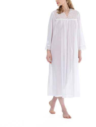 White Full Length (123cm) long sleeve nightgown. Heavy lace throughout the bodice. on the V neckline and long sleeve cuff. Flared skirt for ease of movement when sleeping. Made in Germany from the finest pure Swiss cotton, Celestine nightdresses are diaphanous, offering perfect sleep without heaviness. Celestine nightwear, dressing gowns and short robes drop from the shoulder, therefore one size fits all.  Fabric composition:  100% Pure Swiss Cotton. 100% Guipure Cotton Lace. Machine Washable.