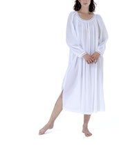 Load image into Gallery viewer, Very beautiful long (124cm) long sleeve nightgown. Lace detail on the gently rounded neckline and the cuff hem. Flared skirt with a side slit for ease of movement when sleeping. Made in Germany from the finest pure Swiss cotton, Celestine nightdresses are diaphanous, offering perfect sleep without heaviness. Fabric composition: 100% Pure Swiss Cotton. 100% Guipure Cotton Lace. Machine Washable.
