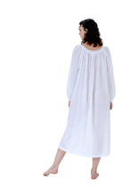 Load image into Gallery viewer, Very beautiful long (124cm) long sleeve nightgown. Lace detail on the gently rounded neckline and the cuff hem. Flared skirt with a side slit for ease of movement when sleeping. Made in Germany from the finest pure Swiss cotton, Celestine nightdresses are diaphanous, offering perfect sleep without heaviness. Fabric composition: 100% Pure Swiss Cotton. 100% Guipure Cotton Lace. Machine Washable.
