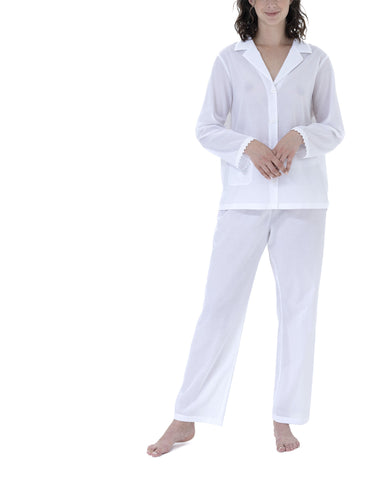 Classic 100% Swiss cotton Pyjamas. Revere collar on loose jacket. There is pocket on the hip and a feminine lace trim on the cuff hem. Full length trousers with a gentle elasticated waist. Made in Germany from the finest pure Swiss cotton, Celestine nightwear is diaphanous, offering perfect sleep without heaviness. Fabric composition: 100% Pure Swiss Cotton. 100% Guipure Cotton Lace. Machine Washable.