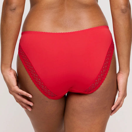 Red underwear with mesh details on a neutral background