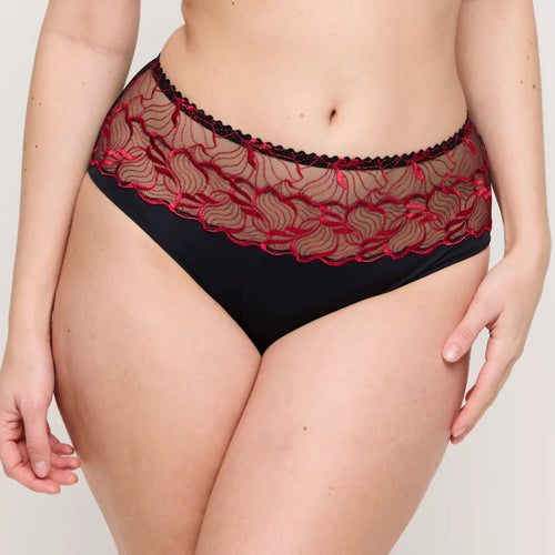 Black lace underwear with red accents on a plain background