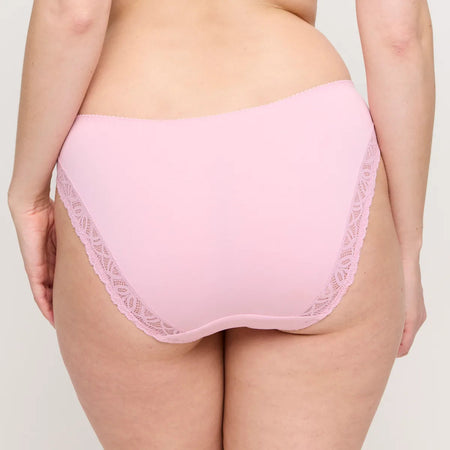 Pink underwear with lace trim on a neutral background