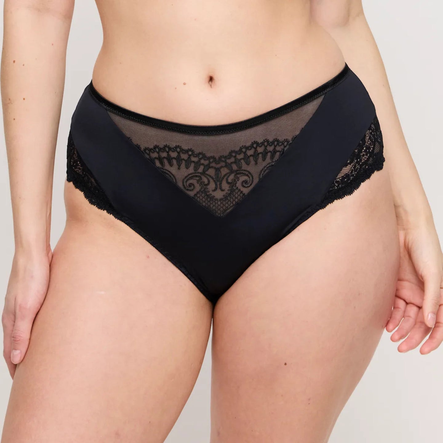 Black lace underwear on a plain background