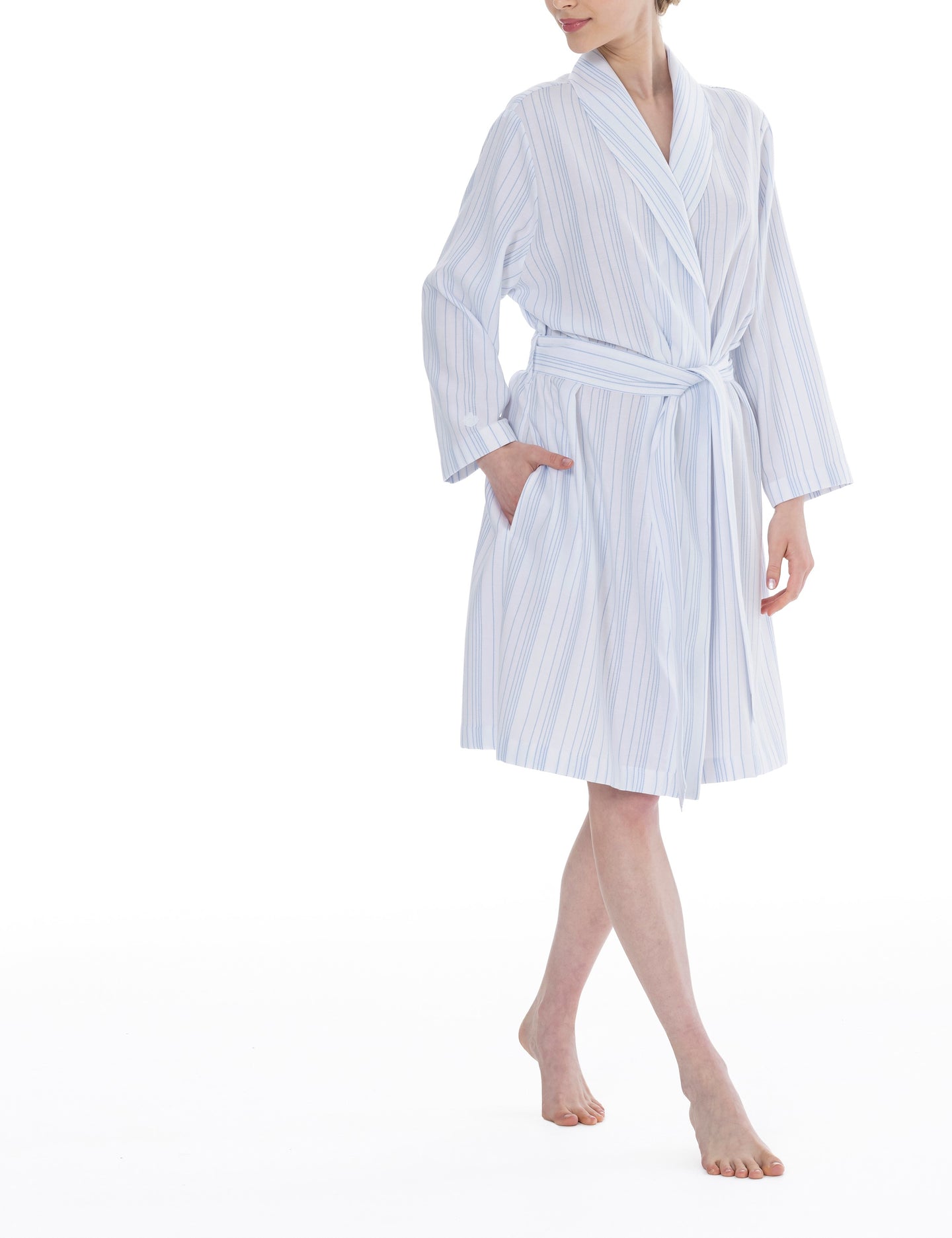 Blue stripe on a white ground, in 100% cashmere soft cotton flannel. Wide belt at the waist with a shawl collar. Inverted side pocket. Soft, stylish and comfortable for perfect lounging. Celestine nightwear, dressing gowns, short robes and pyjamas drop from the shoulder, therefore one size fits all.  Fabric composition: 100% Cotton Flannel. Made in Germany. Machine Washable.