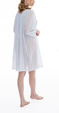 Load image into Gallery viewer, Short (96cm) long sleeve nightgown. Lace details on the gently rounded neckline, cuffs &amp; hemline. Flared skirt for ease of movement when sleeping. Made in Germany from the finest pure Swiss cotton, Celestine nightdresses are diaphanous, offering perfect sleep without heaviness. Celestine nightwear, dressing gowns and short robes drop from the shoulder, therefore one size fits all.  Fabric composition:  100% Pure Swiss Cotton. 100% Guipure Lace. Machine Washable. Azure.
