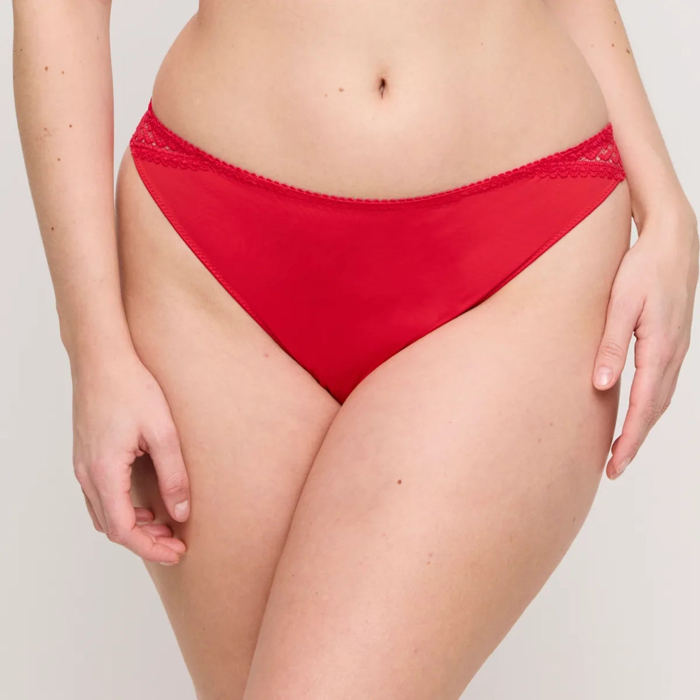 Red bikini bottom on a plain background