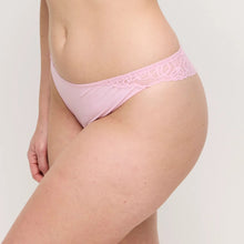 Load image into Gallery viewer, Pink lace underwear worn by a person on a plain background
