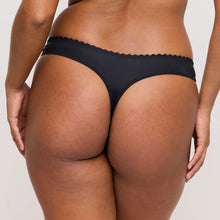 Load image into Gallery viewer, Person wearing black underwear on a plain background
