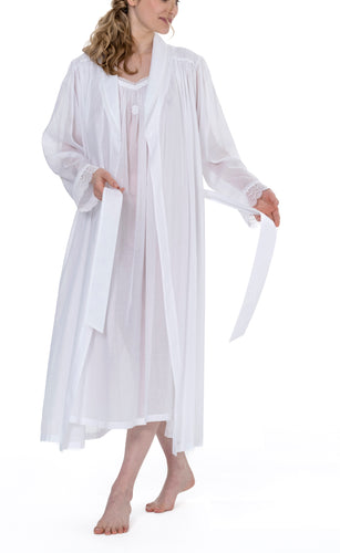 Full length (128cm) Shawl Collar robe. Lace trim on the shawl collar, reflected in a wide lace detail on the cuffs. Hidden side pocket and waist belt complete this garment.  Made in Germany from the finest mousseline, This robe offers the wearer perfect cover without heaviness. Celestine nightwear, dressing gowns and short robes drop from the shoulder, therefore one size fits all.  Composition:  100% Pure Swiss Cotton 100% Cotton Lace Machine Washable