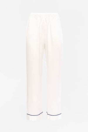 Our own classic pure silk 'men's style' pyjamas. They are made from 19 mm 100% pure heavyweight Silk Satin. One seam on the leg for extra comfort.  Mother-of-pearl buttons, elastic waist the trousers. Perfect for sleeping and loungewear.  Available in two colourways: Ivory/Navy Piping.