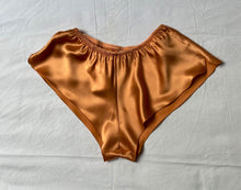 Load image into Gallery viewer, 100% Pure Silk French Knickers.   Elastic waist band and loose leg fitting. We have a large selection of colours and sizes to suit all tastes. Shapes may vary depending on colour choice. All traditional, all French knickers.  Fabric Content: 100% Pure Silk Made in Italy. Apricot.
