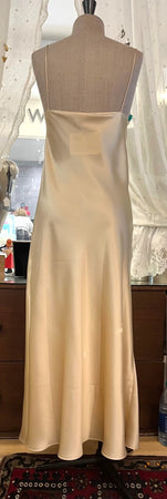 Full length, heavy weight pure silk satin nightdress with delicate contrasting embroidered lace coveing the entire bust. Spaghetti straps, with a V neck style. The skirt is full length and cut on the bias for full movement. It has a lace trimmed side slit for ease of movement.  100% Pure Silk Satin Made in Italy Machine washable