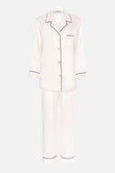 Our own classic pure silk 'men's style' pyjamas. They are made from 19 mm 100% pure heavyweight Silk Satin. One seam on the leg for extra comfort.  Mother-of-pearl buttons, elastic waist the trousers. Perfect for sleeping and loungewear.  Available in two colourways: Ivory/Navy Piping.