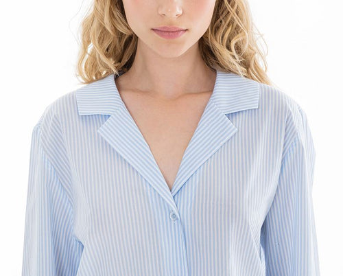 Blue stripe on a white ground, in 100% Swiss cotton flannel. Buttoned at the front with a revere collar. Lace detail on the cuffs. Full length trouser with a soft elasticated waist. Perfect for sleeping or lounging.  Celestine garments are also addictive, so watch out. Once tried, there is no turning back!  Celestine nightwear, dressing gowns, short robes and pyjamas drop from the shoulder, therefore one size fits all.  Fabric composition: 100% Swiss Cotton. Made in Germany. Machine Washable.