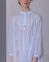 Load image into Gallery viewer, Short (95cm) long sleeve nightgown. Round high neck with button detail. Beautiful embroidery on the front, sleeves and back yoke. Narrow lace on the cuffs. Flared skirt for ease of movement when sleeping. Made in Germany from the finest pure Swiss cotton, Celestine nightdresses are diaphanous, offering perfect sleep without heaviness. Fabric composition:  100% Pure Swiss Cotton. 100% Guipure Lace. Machine Washable.

