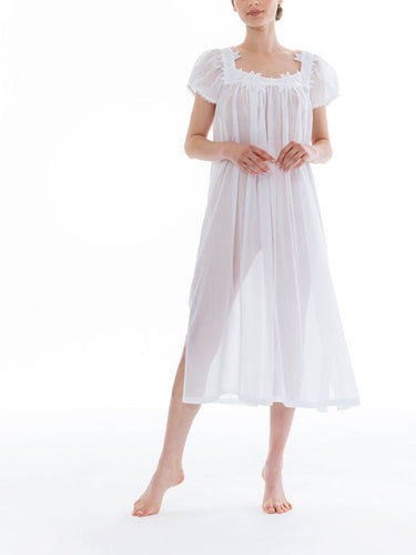 Full length (123cm) short sleeve nightgown. Lace details on the square neck, & sleeve edge. Flared skirt for ease of movement when sleeping. Made in Germany from the finest pure Swiss cotton, Celestine nightdresses are diaphanous, offering perfect sleep without heaviness. Celestine nightwear, dressing gowns and short robes drop from the shoulder, therefore one size fits all.  Fabric composition:  100% Pure Swiss Cotton. 100% Guipure Cotton Lace. Machine Washable.