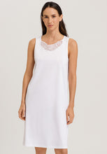 Load image into Gallery viewer, Made from 100% soft mercerised knitted cotton. This is a lovely sleeveless nightgown. Rounded lace detail at the neck. Light and airy to wear in bed.  Deliciously comfortable for sleeping and lounging.  Length: 100cm  Composition: 100% Pure Cotton 100% Polyester Lace  Made in Europe Machine washable Pure White.
