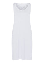 Load image into Gallery viewer, Made from 100% soft mercerised knitted cotton. This is a lovely sleeveless nightgown. Rounded lace detail at the neck. Light and airy to wear in bed.  Deliciously comfortable for sleeping and lounging.  Length: 100cm  Composition: 100% Pure Cotton 100% Polyester Lace  Made in Europe Machine washable Pure White.
