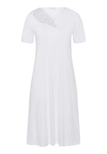 Load image into Gallery viewer, Made from 100% soft mercerised knitted cotton. Delighful asymmetric appliqué lace detail at the neckline. This is a lovely short sleeve nightgown. Deliciously comfortable for sleeping and lounging.  Length: 100cm  Composition: 100% Pure Cotton 100% Polyester Lace  Made in Europe Machine washable. Pure White.
