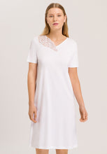 Load image into Gallery viewer, Made from 100% soft mercerised knitted cotton. Delighful asymmetric appliqué lace detail at the neckline. This is a lovely short sleeve nightgown. Deliciously comfortable for sleeping and lounging.  Length: 100cm  Composition: 100% Pure Cotton 100% Polyester Lace  Made in Europe Machine washable. Pure White.
