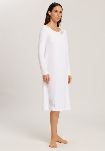Made from 100% soft mercerised knitted cotton. This is a lovely 3/4 length long sleeve nightgown. Rounded neckline with an appliqué lace inset at the neck & front hem. Perfect item for lounging or sound sleep. Deliciously comfortable for sleeping and lounging.  Length: 110cm  Composition: 100% Pure Cotton 100% Polyester Lace  Made in Europe Machine washable. Pure White.