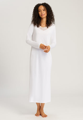 Made from 100% soft mercerised knitted cotton. This is a lovely full length long sleeve nightgown. Gently rounded neckline with a delicate appliqué lace detail. Deliciously comfortable for sleeping and lounging.  Length: 130cm  Composition: 100% Pure Cotton 100% Polyester Lace  Made in Europe Machine washable. Soft White.