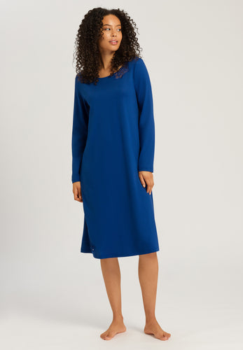 Made from 100% soft mercerised knitted cotton. This is a lovely 3/4 length long sleeve nightgown. Rounded neckline with an appliqué lace inset at the neck & front hem. Perfect item for lounging or sound sleep. Deliciously comfortable for sleeping and lounging.  Length: 110cm  Composition: 100% Pure Cotton 100% Polyester Lace. Indigo Blue.