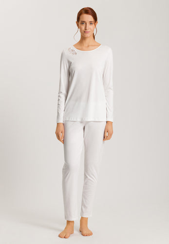 Soft White. Made from 100% soft mercerised knitted cotton, Rounded neckline with an appliqué asymmetric lace inset at the neckline.  Long sleeves and with slender fitting trousers, elasticated at the waist. Perfect item for lounging or sound sleep.
Composition:
100% Pure Cotton
100% Polyester Lace
Made in Europe
Machine washable
