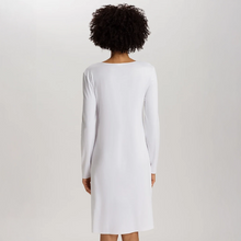 Load image into Gallery viewer, Embrace modern comfort with Hanro Cotton Silk - Long Sleeved Nightdress. This piece features a soft, mercerised cotton interlock construction, enhanced by subtle silk details. The long sleeves and ideal length of 100cm makes it perfect for a stylish and comfortable night's rest or relaxed lounging.
