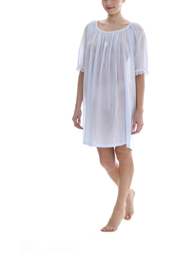 Azure Short (98cm) 3/4 Length Sleeve nightgown. Gorgeous 100% Guipure Cotton Lace at the gently rounded neckline and sleeve edge. Flared skirt for ease of movement when sleeping. Made in Germany from the finest pure cotton mousseline, Celestine nightdresses are diaphanous, offering perfect sleep without heaviness.
Celestine nightwear, dressing gowns and short robes drop from the shoulder, therefore one size fits all. 
Composition: 100% Pure Swiss Cotton, 100% Guipure Cotton Lace
Machine Washable.
