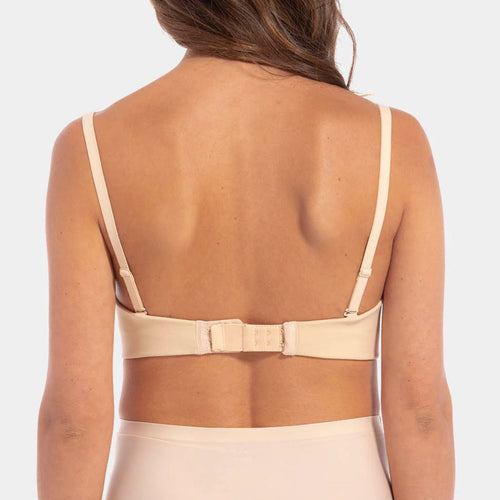 Beige bra with a bow detail on a plain background