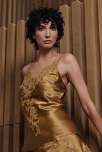Load image into Gallery viewer, Caramel gold colour set.
This Marjolaine camisole and French knicker set is generously embellished with appliqué Calais lace. Camisole has spaghetti adjustable straps and the appliqué lace forms a sumptuous detail on the front, continuing down the front of the garment. The French Knickers have a sumptuous detail of appliqué lace on both hips. Its tone-on-tone Calais lace makes it a piece rich in luxurious details, while maintaining an airy yet comfy cut.
