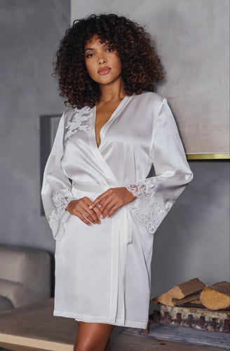 The Ivory Deia robe is knee length made in beautiful heavy-weight pure silk satin. It is belted at the waist with a side pocket.

Tone on tone Calais lace appliqué on the shoulder and sleeves gives additional femininity to the stunning robe. Essential for those who love quality and refined, timeless style.