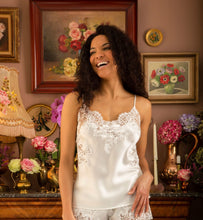 Load image into Gallery viewer, Ivory. Pure Silk Camisole &amp; Frenck Knicker Set. They are generously embellished with appliqué Calais lace. The Camisole has rouleau adjustable straps. The appliqué lace forms a sumptuous detail on the front, continuing down the sides of the garment. The French Knickers have a sumptuous derail of appliqué lace on both hips.  Ink/Ivory Smoke/Black Ivory/Ivory  Composition: 100% Silk Satin  Calais Lace 75% Cotton, 25% Nylon Machine washable
