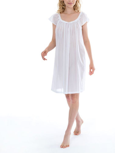 Short (97cm) cap nightgown. Lace details on the rounded neckline. Flared skirt for ease of movement when sleeping. Made in Germany from the finest pure Swiss cotton, Celestine nightdresses are diaphanous, offering perfect sleep without heaviness. Celestine nightwear, dressing gowns and short robes drop from the shoulder, therefore one size fits all.  Fabric composition:  100% Pure Swiss Cotton. 100% Guipure Cotton Lace. Machine Washable.