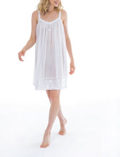Load image into Gallery viewer, Smart short (91cm) sleeveless nightgown. Lace details on the gentle V neck &amp; spaghetti strap. The hemline has a wide embroidered detail adding an extra flourish to this lovely nightgown. Flared skirt for ease of movement when sleeping. Celestine nightdresses are diaphanous, offering perfect sleep without heaviness. Celestine nightwear, dressing gowns and short robes drop from the shoulder, therefore one size fits all.  100% Pure Swiss Cotton. 100% Guipure Cotton Lace. Machine Washable.
