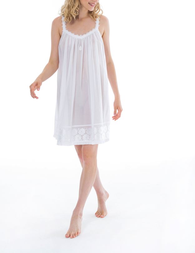Smart short (91cm) sleeveless nightgown. Lace details on the gentle V neck & spaghetti strap. The hemline has a wide embroidered detail adding an extra flourish to this lovely nightgown. Flared skirt for ease of movement when sleeping. Celestine nightdresses are diaphanous, offering perfect sleep without heaviness. Celestine nightwear, dressing gowns and short robes drop from the shoulder, therefore one size fits all.  100% Pure Swiss Cotton. 100% Guipure Cotton Lace. Machine Washable.