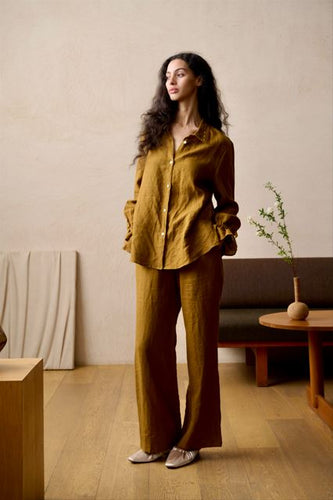 100% Pure Linen Pyjamas made by Luuna Mine; an artisan design studio based in Shanghai. The jacket has a shirt tail at the back, a gathered frilled cuff on the sleeve and signature moon embroidery detail on the classic collar. The trousers have two side pockets, a wide leg and an elasticated waist & French seams throughout. Perfect for sleeping and loungewear. Composition: 100% Linen. Machine washable. Sizing advice: These pyjamas come up small. If in doubt, select the bigger size.