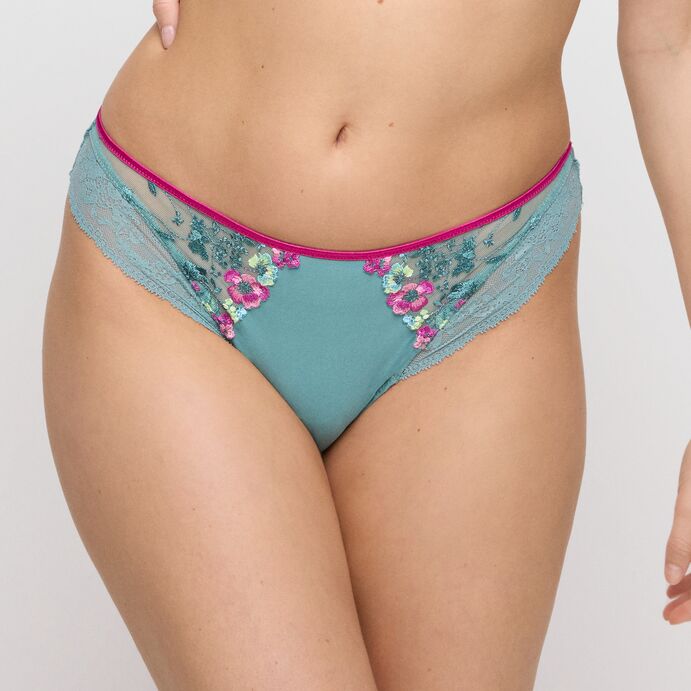 The Lizelot Rio Brief in Bali Green has a soft fabric in the center with contrasting fuchsia embroidered flowers followed by a delicate floral lace on the edge.
The elasticated trim at the top is also in c contrasting fuchsia pink.
The back of the brief is all made of soft delicate floral lace providing invisible comfort underneath clothing.